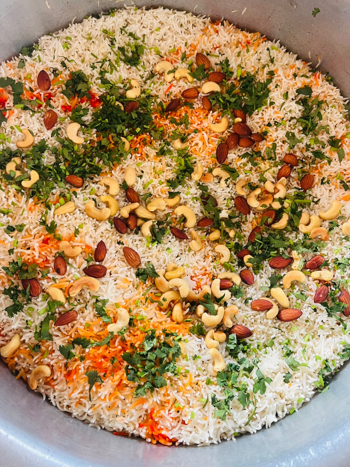 Rice topped with herbs and nuts