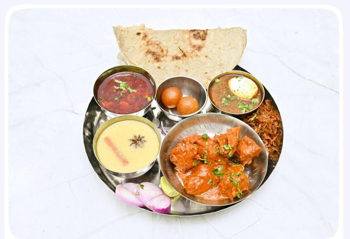 Special non-veg thali with chicken and egg curries
