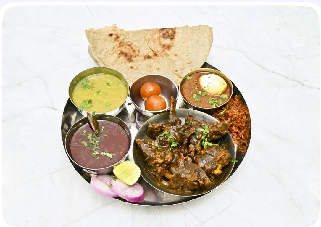 Mutton thali with kala masala curry and bhakri