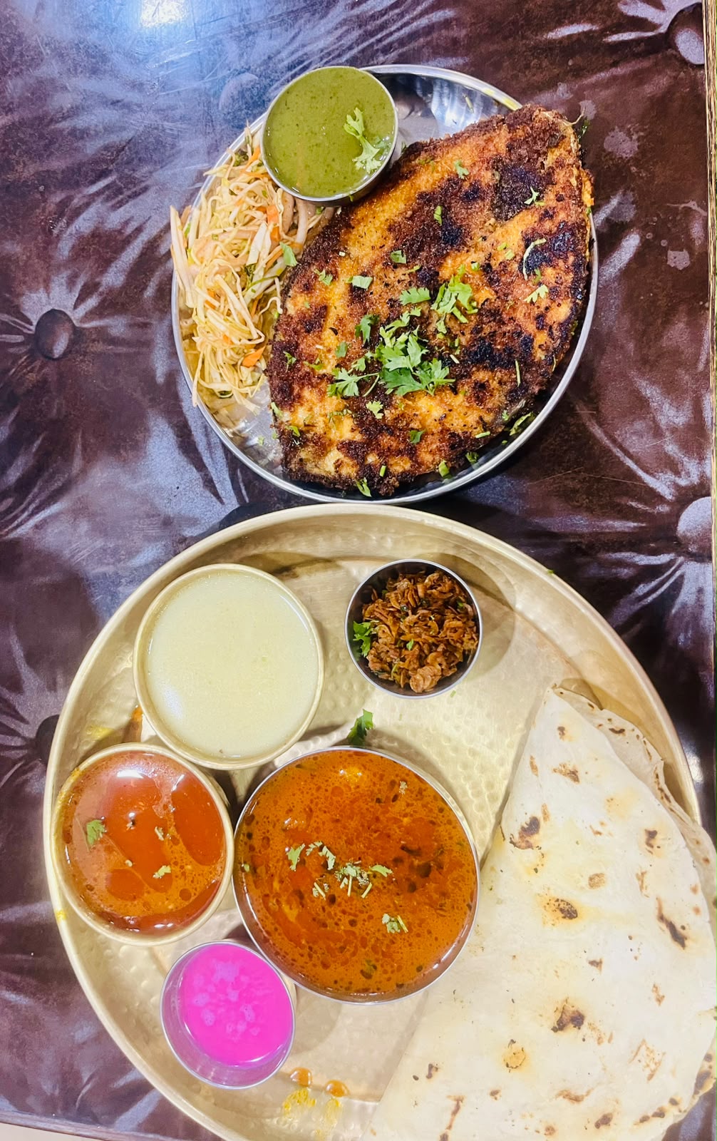 Crisp fried fish with a thali of rassa, sol kadhi and chapati