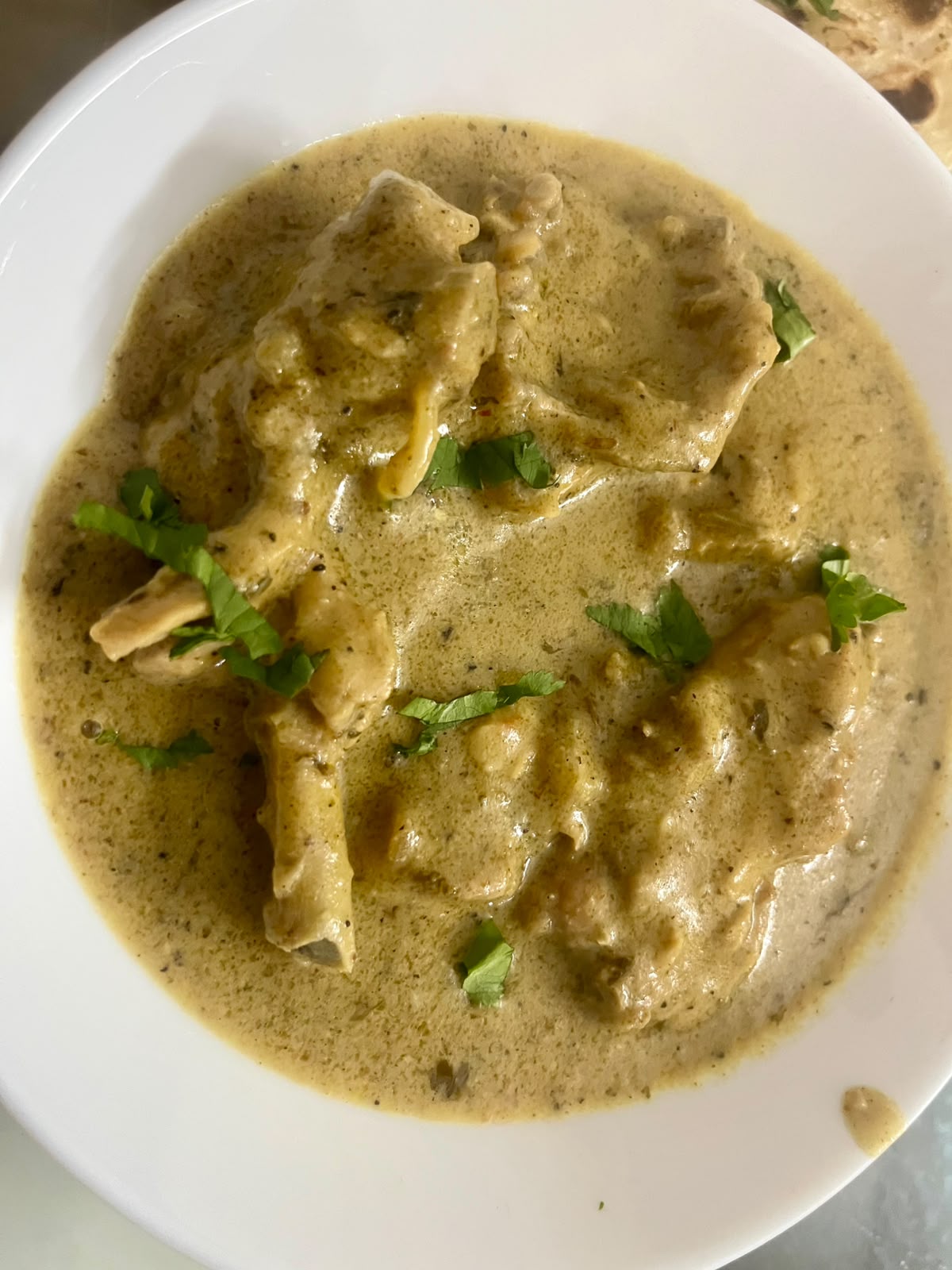 Pandhara rassa — creamy white mutton gravy