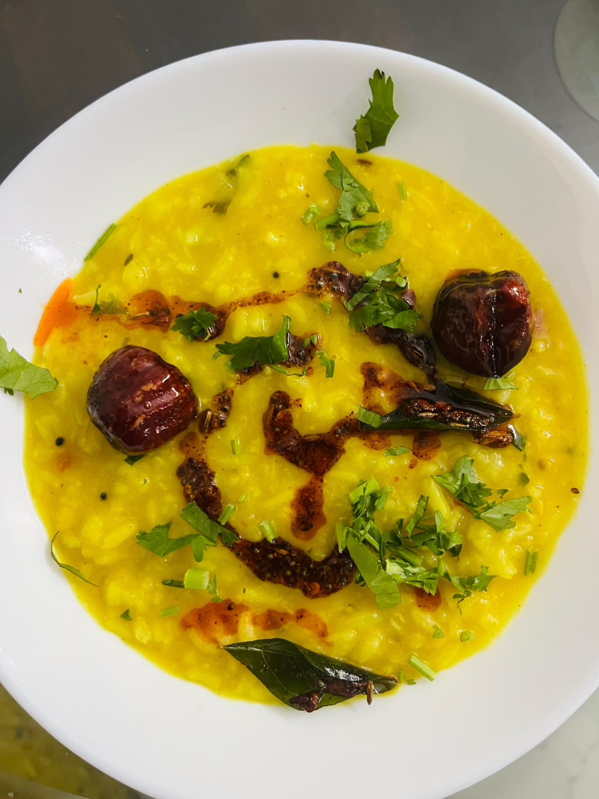 Dal tadka topped with tempering and coriander